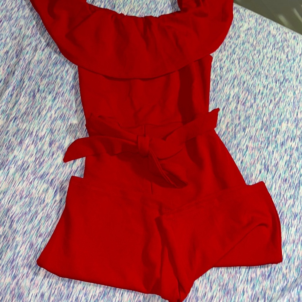Velvet Red Jumpsuit with flared off the shoulder neck line.